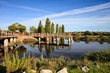 Image showing The garden and the lake.