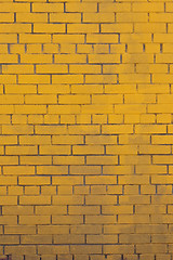 Image showing Background with old yellow painted brick wall