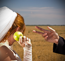 Image showing apple offers the bride to the groom