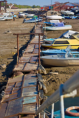 Image showing boat marina and a boat moored near the shore