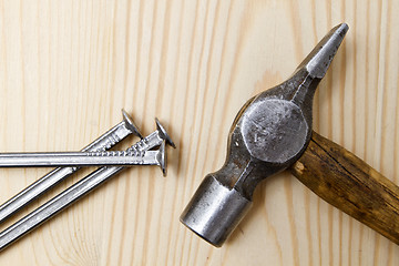 Image showing Old hammer and nails 