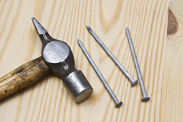 Image showing Old hammer and nails 