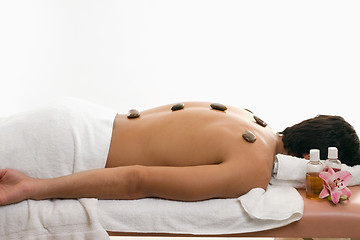 Image showing Male thermal stone spa treatment