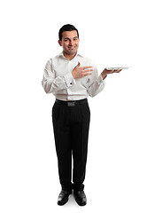 Image showing Waiter or servant holding a white plate