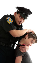 Image showing Police officer apprehending a teenage thief