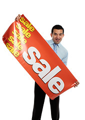 Image showing Business or salesman holding Sale Banner