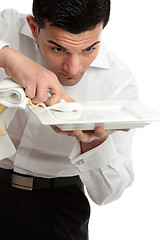 Image showing Waiter servant cleaning presenting plate