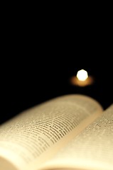 Image showing book and candle