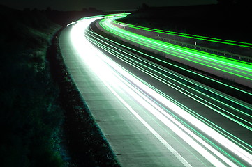 Image showing road with car traffic at night with blurry lights