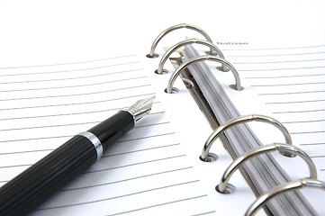 Image showing business organizer and pen