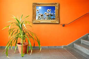 Image showing picture on a wall and plant