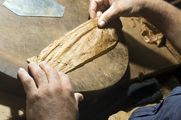 Image showing hand rolling cigar production