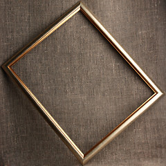 Image showing Bronze frame on grunge textile background