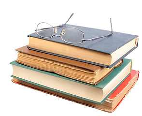 Image showing Glasses and group of old dirty books