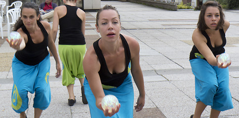 Image showing Dancers holding a ball