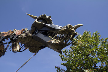 Image showing Dragon eating some leaves