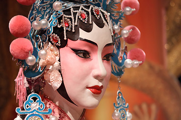 Image showing chinese opera dummy and red cloth as text space ,it is a toy,not