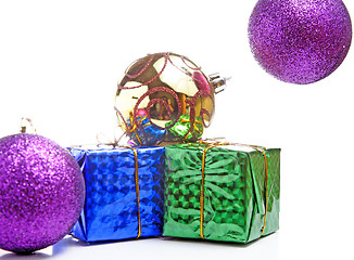 Image showing beautiful gifts with gold bows and Christmas ball