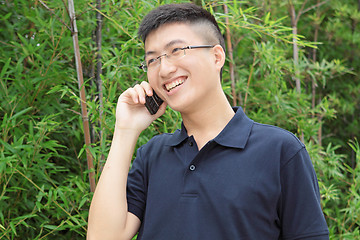 Image showing asia man talking on phone