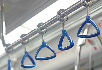 Image showing handle on a train. 