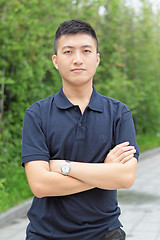 Image showing young business man stand and hand cross