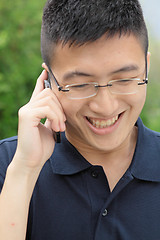 Image showing asia man talking on phone