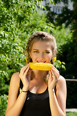 Image showing woman eating corn-cob