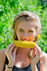 Image showing woman eating corn-cob