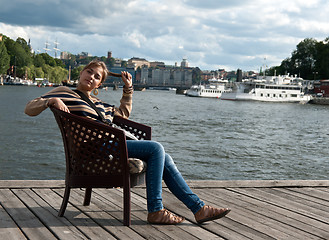 Image showing girl sitting in the pier