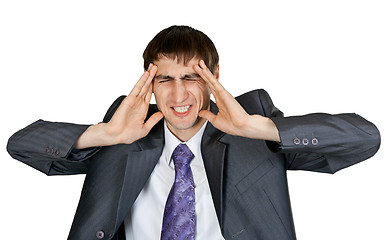 Image showing businessman in a gray suit with a headache in the studio