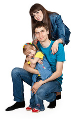 Image showing father, mother and young daughter in jeans