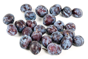 Image showing Ripe plums are scattered