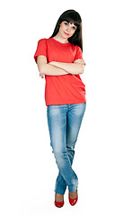 Image showing girl in red shoes and blue jeans in the studio