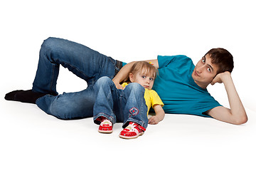 Image showing dad and little daughter lying on the floor