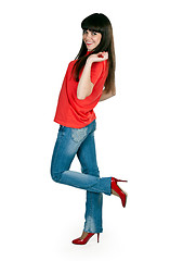 Image showing girl in red clothes and blue jeans in the studio