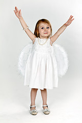 Image showing little girl with angel wings in the studio