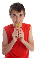 Image showing A boy eating soft jelly lollies