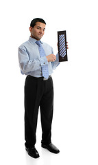 Image showing Salesman holding a silk tie