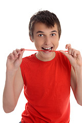 Image showing Smiling boy eating candy