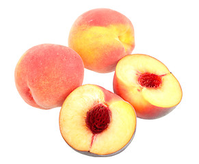 Image showing Group of four yellow-red peaches