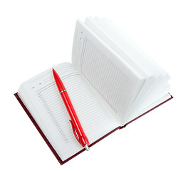 Image showing Empty open diary and red ball point pen