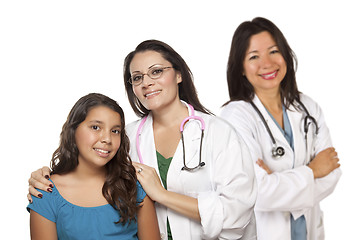 Image showing Hispanic Female Doctor with Child Patient and Colleague Behind