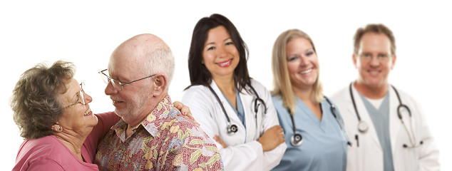 Image showing Senior Couple with Medical Doctors or Nurses Behind