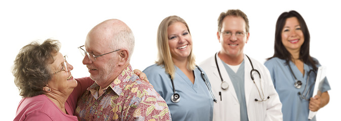 Image showing Senior Couple with Medical Doctors or Nurses Behind