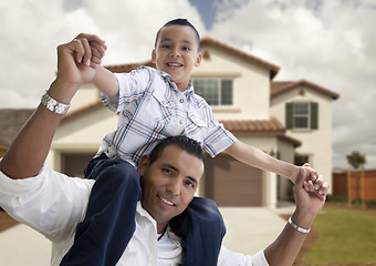 Image showing Hispanic Father and Son in Front of House