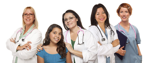 Image showing Hispanic Female Doctor with Child Patient and Colleagues Behind