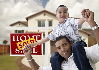 Image showing Hispanic Father and Son in Front of House, Sold Sign