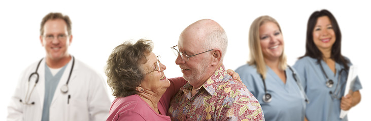 Image showing Senior Couple with Medical Doctors or Nurses Behind