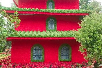 Image showing Chinese building model made of flowers