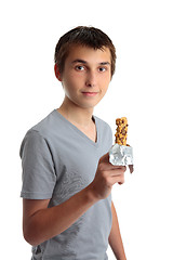 Image showing Boy holding a nutritional snack bar